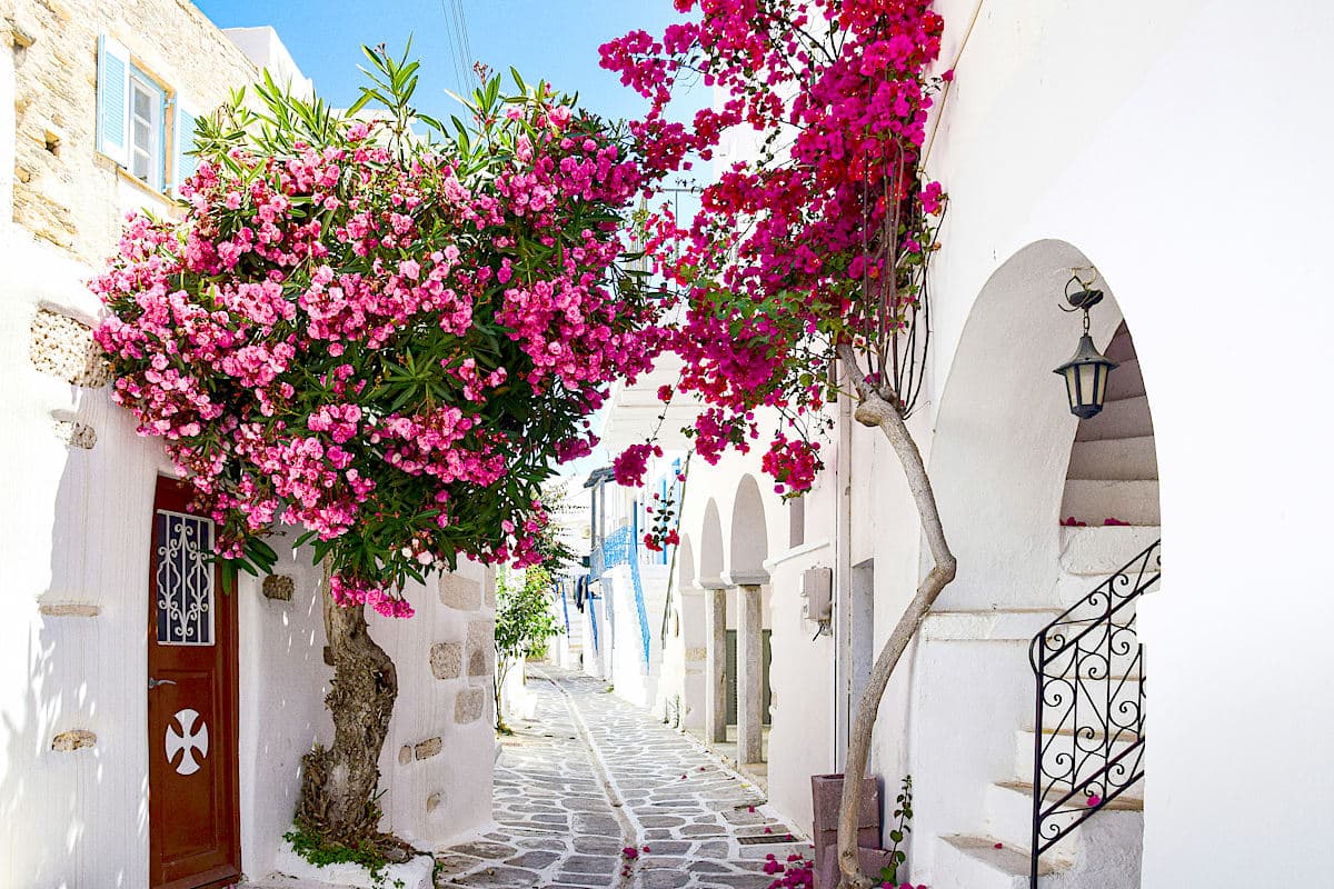 Golden Beaches and Iconic Blue-and-White Houses